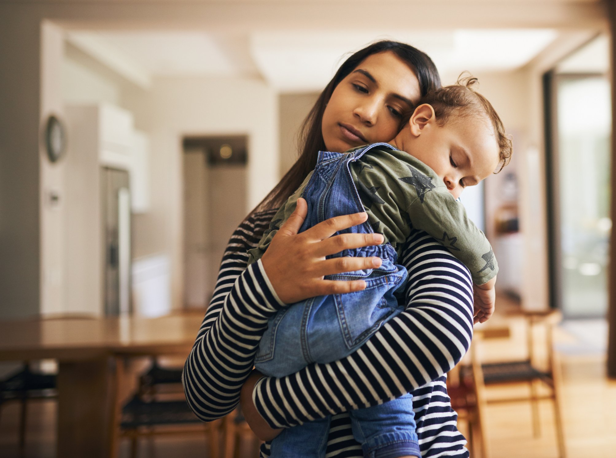 mom-holding-sleeping-toddler