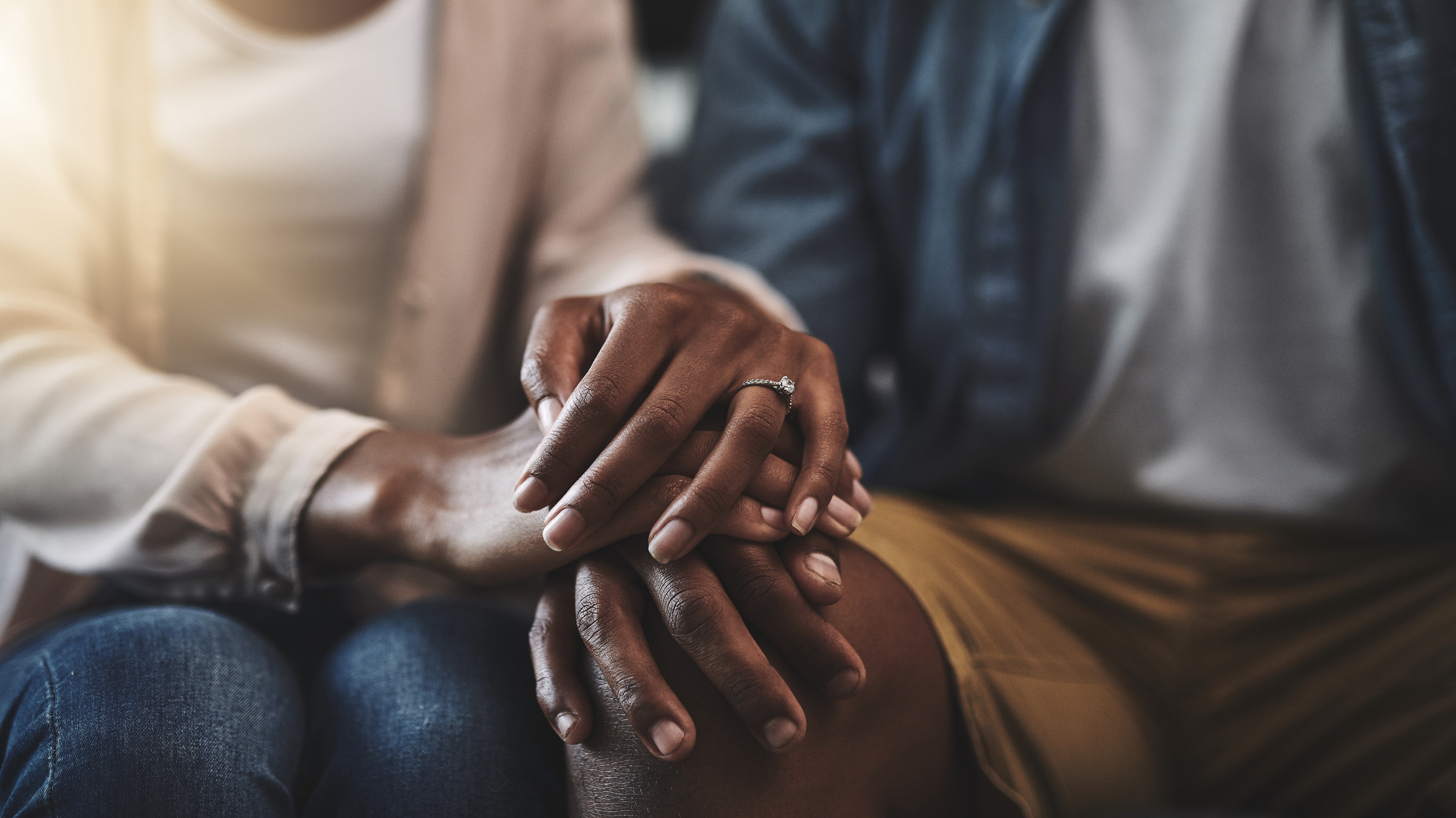 A married couple holding hands
