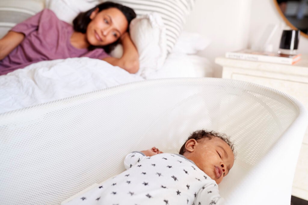 mom watching sleeping baby