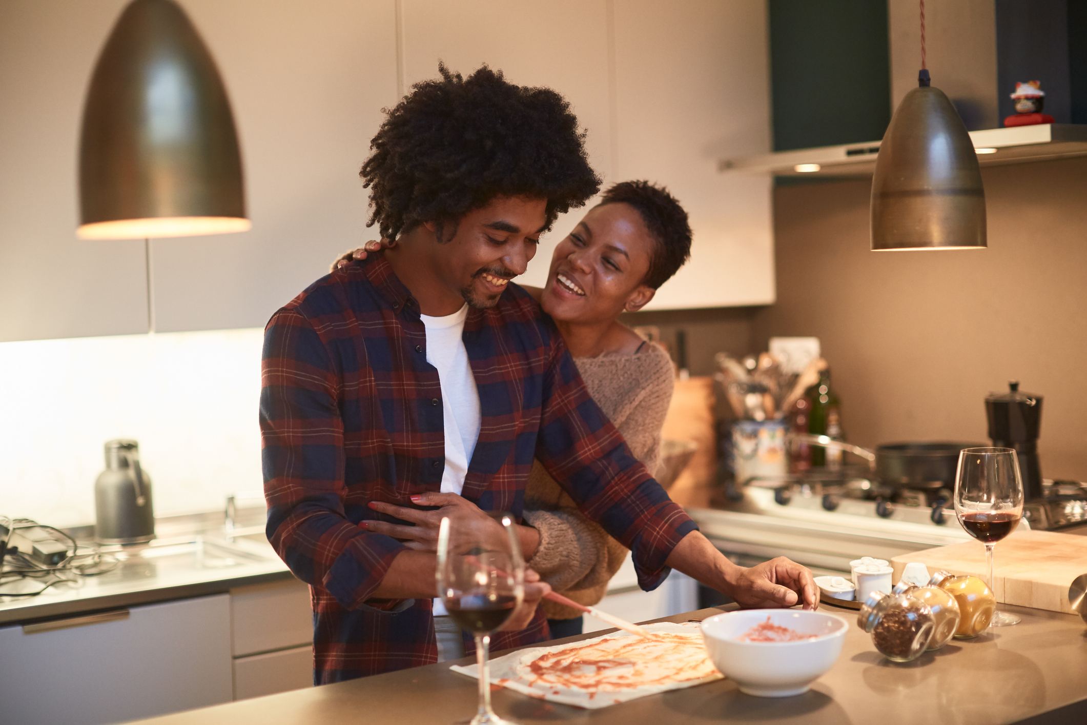 Young couple cooking at home and celebrating Saint Valentine