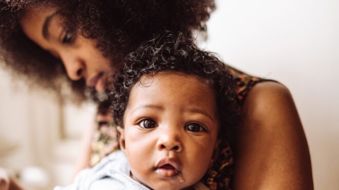 mom holding baby