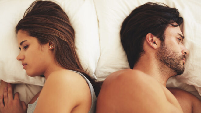 couple-bed-backs-turned