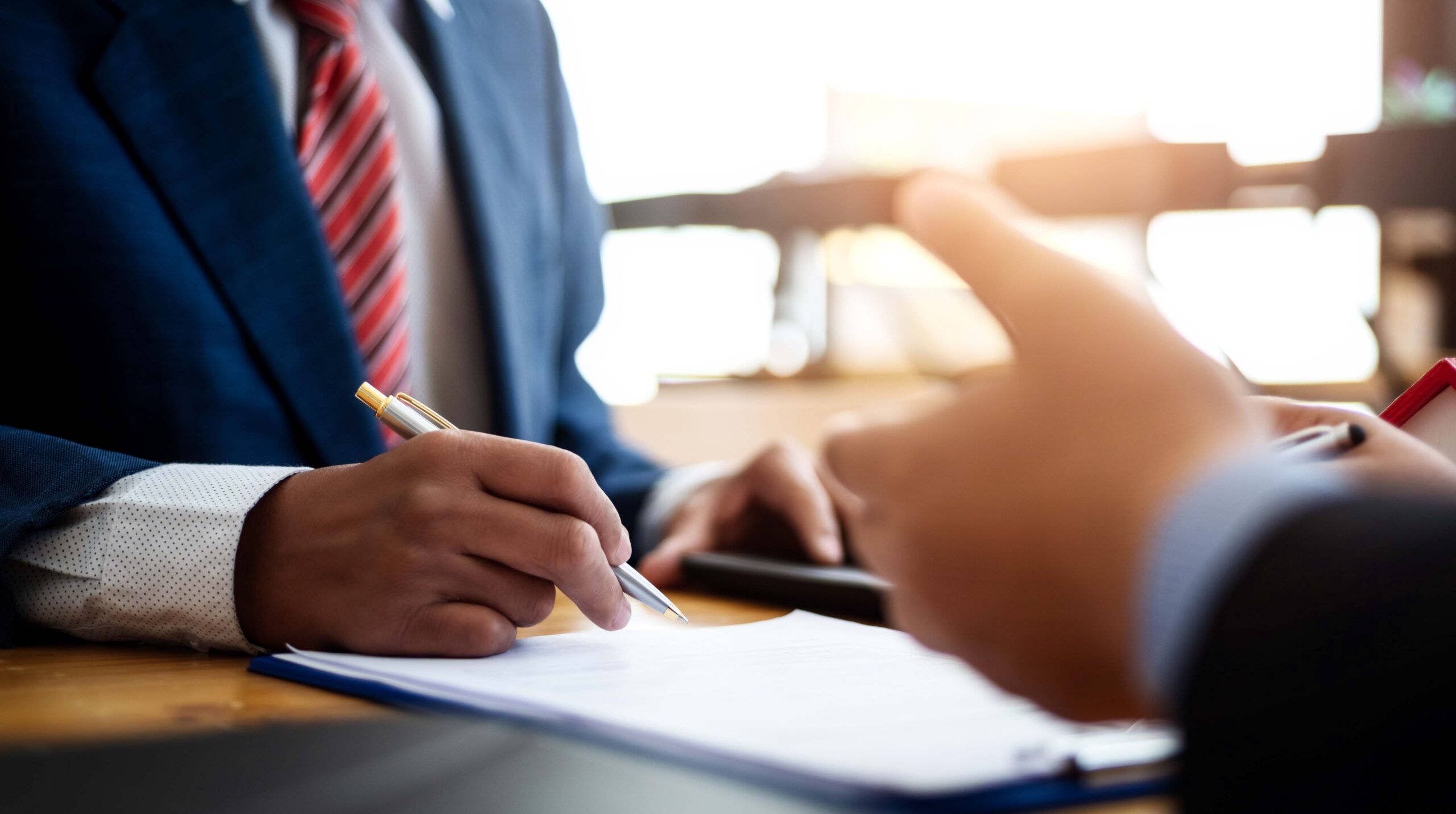 Business people discussion and negotiating investment housing estate with sign a contract term loan facility in office. contract and agreement concept.