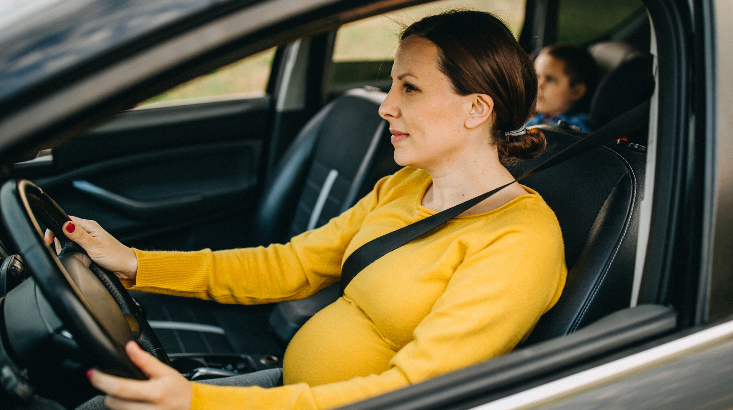 Mother and son driving in a car
