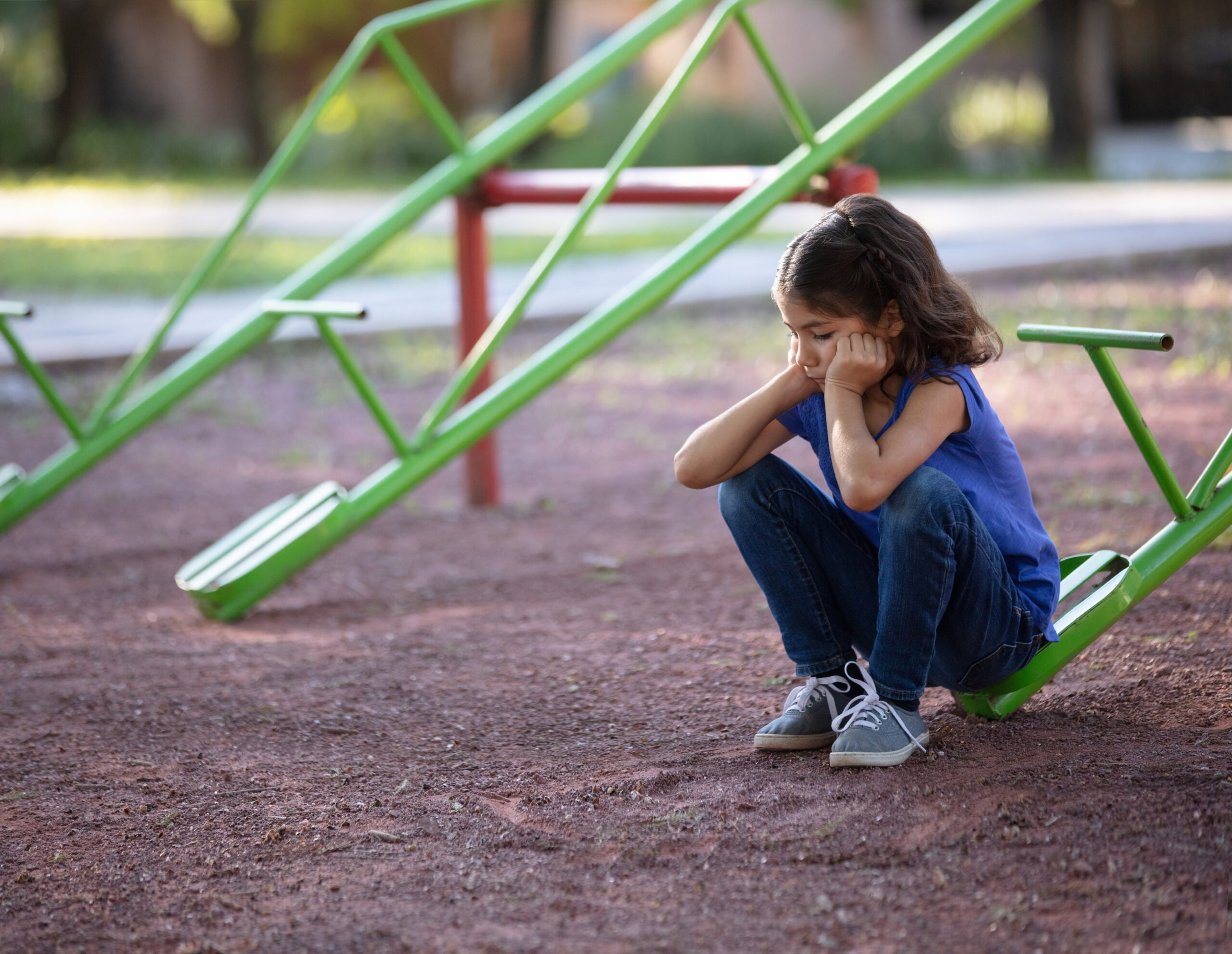 sad girl on playground