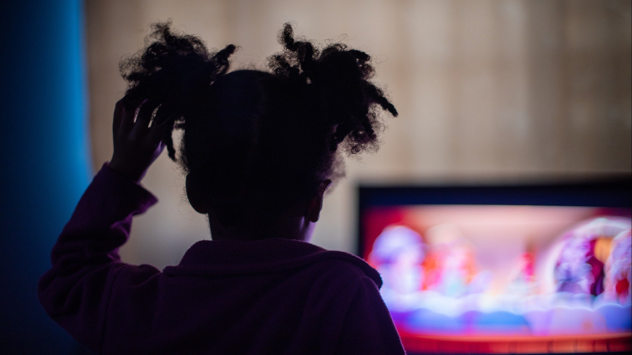 A kid watching tv