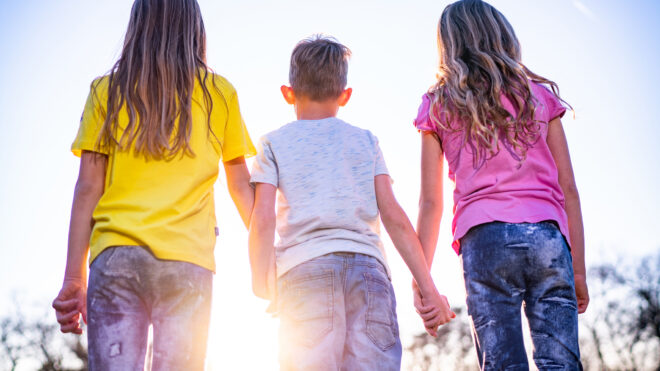 three-kids-holding-hands