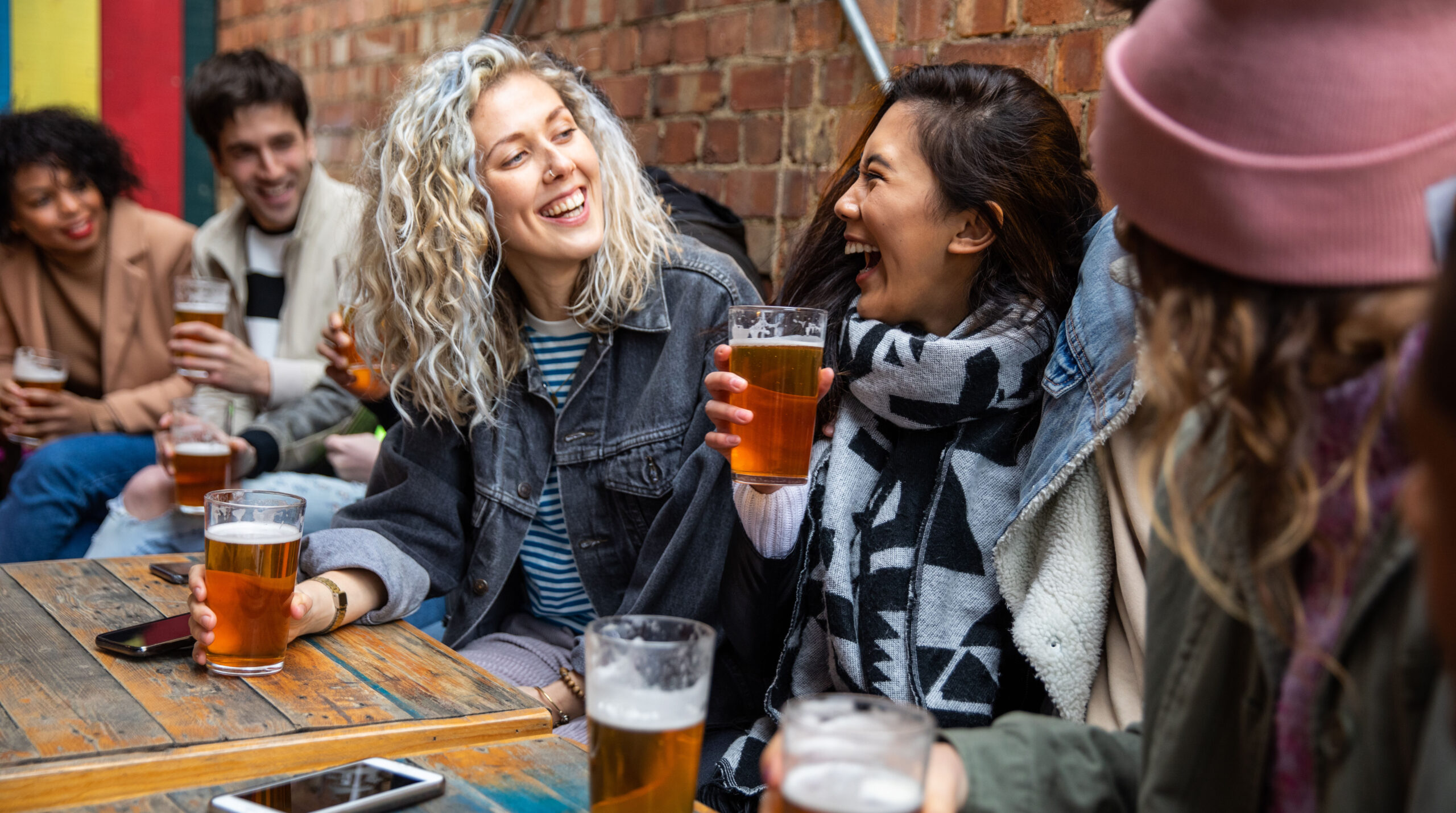 Londoners group of friends meet up in a pub
