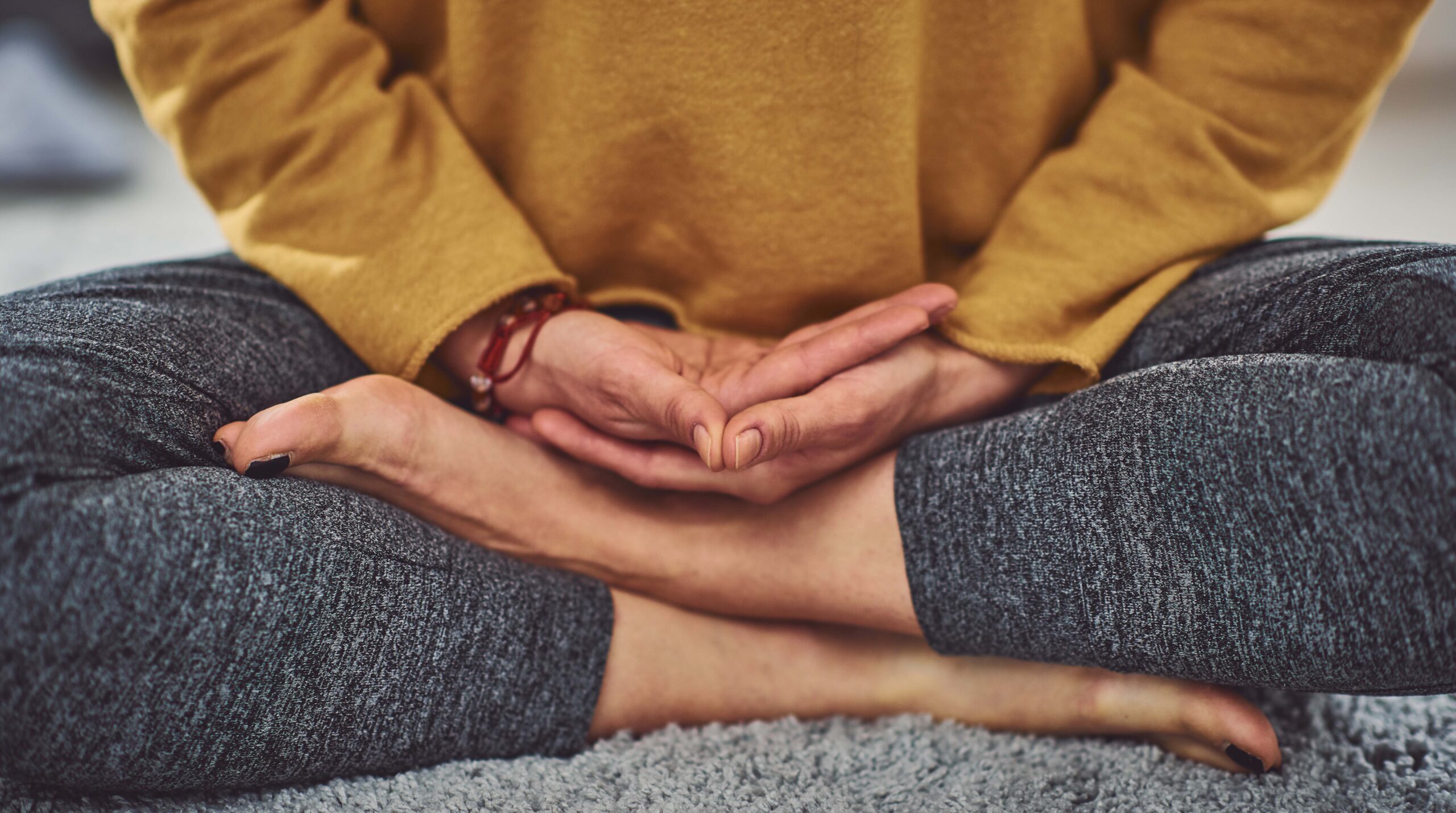 Close up of caucasian woman meditating indoors.