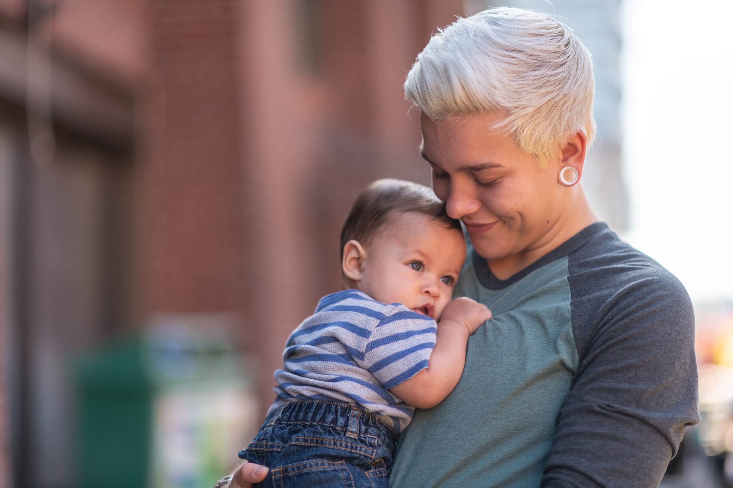 Non-binary gender parent with baby