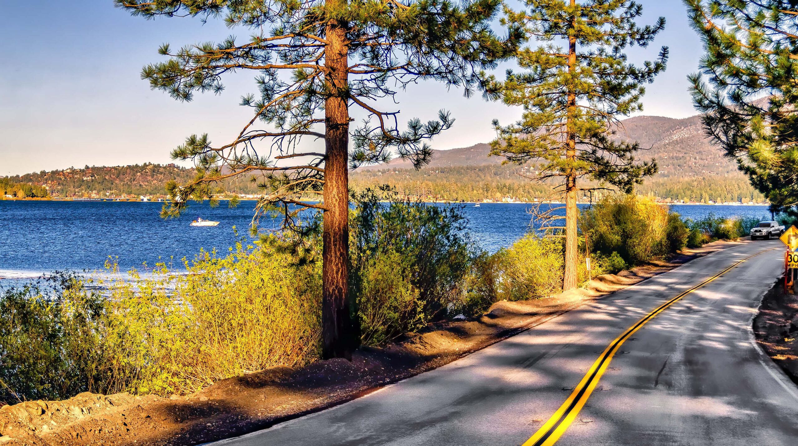 View of a California highway alongside Big Bear Lake.