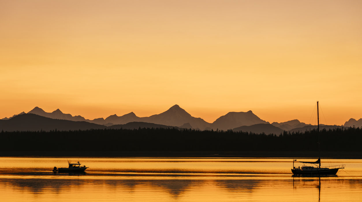 Orange sunset sky over the Fairweather range from Bartlett Cove, Glacier Bay National Park