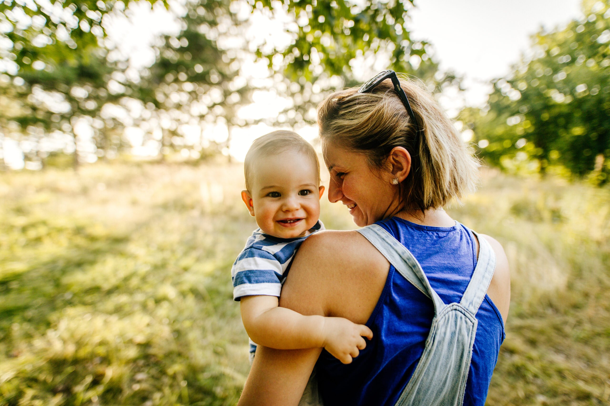 Baby boy with mommy in the nature