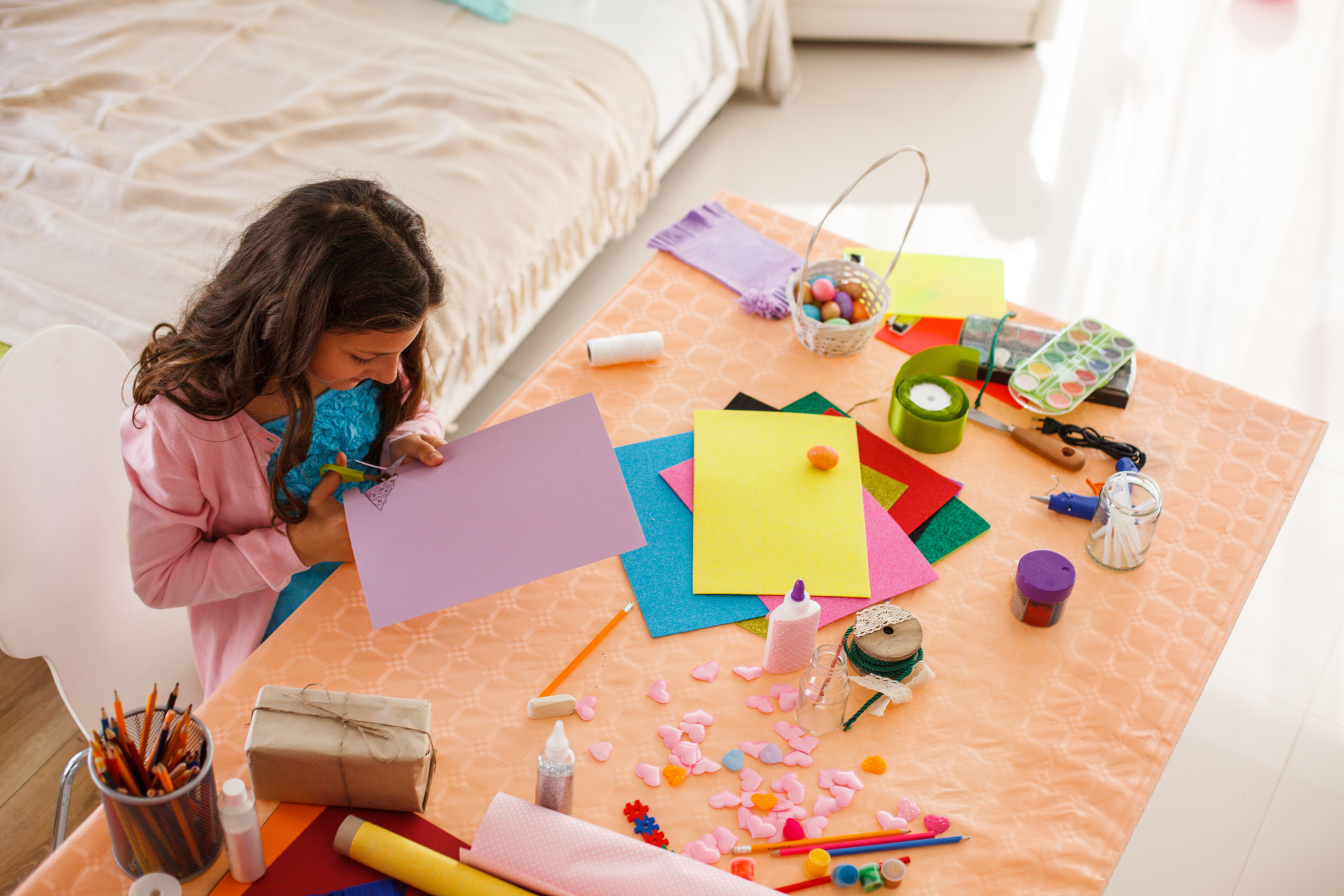 Girl making Easter decoration at home