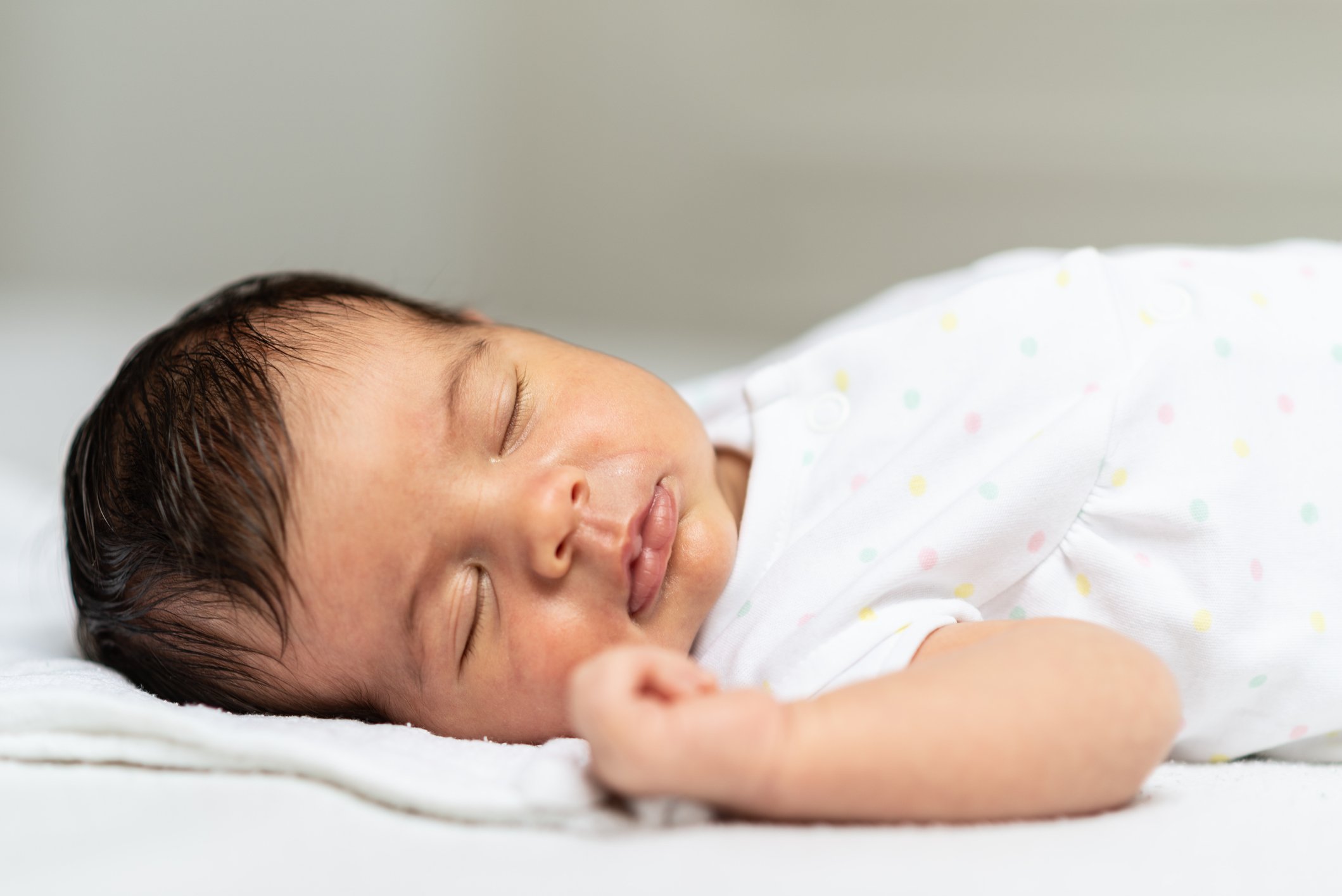 Sleeping newborn baby girl