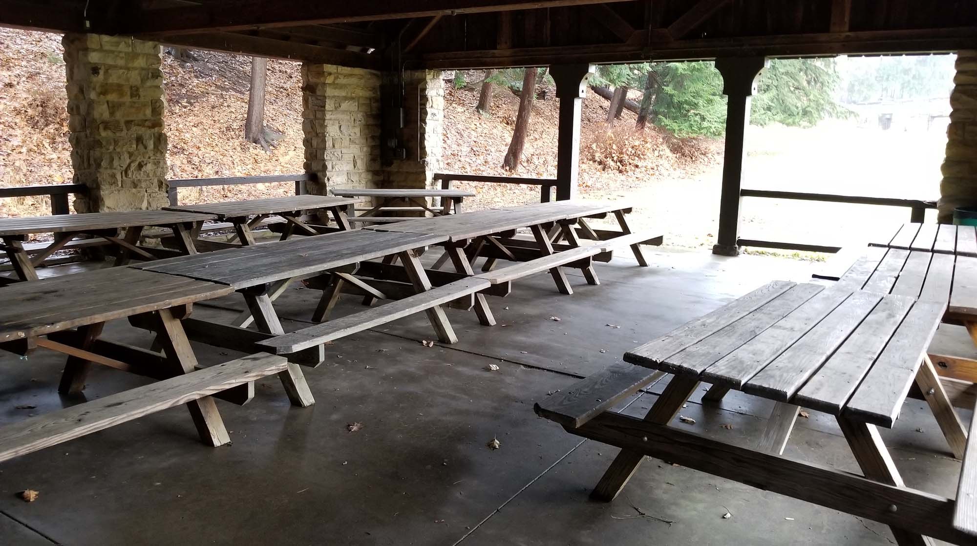 State park meeting or dining area in shelter house with wooden picnic tables
