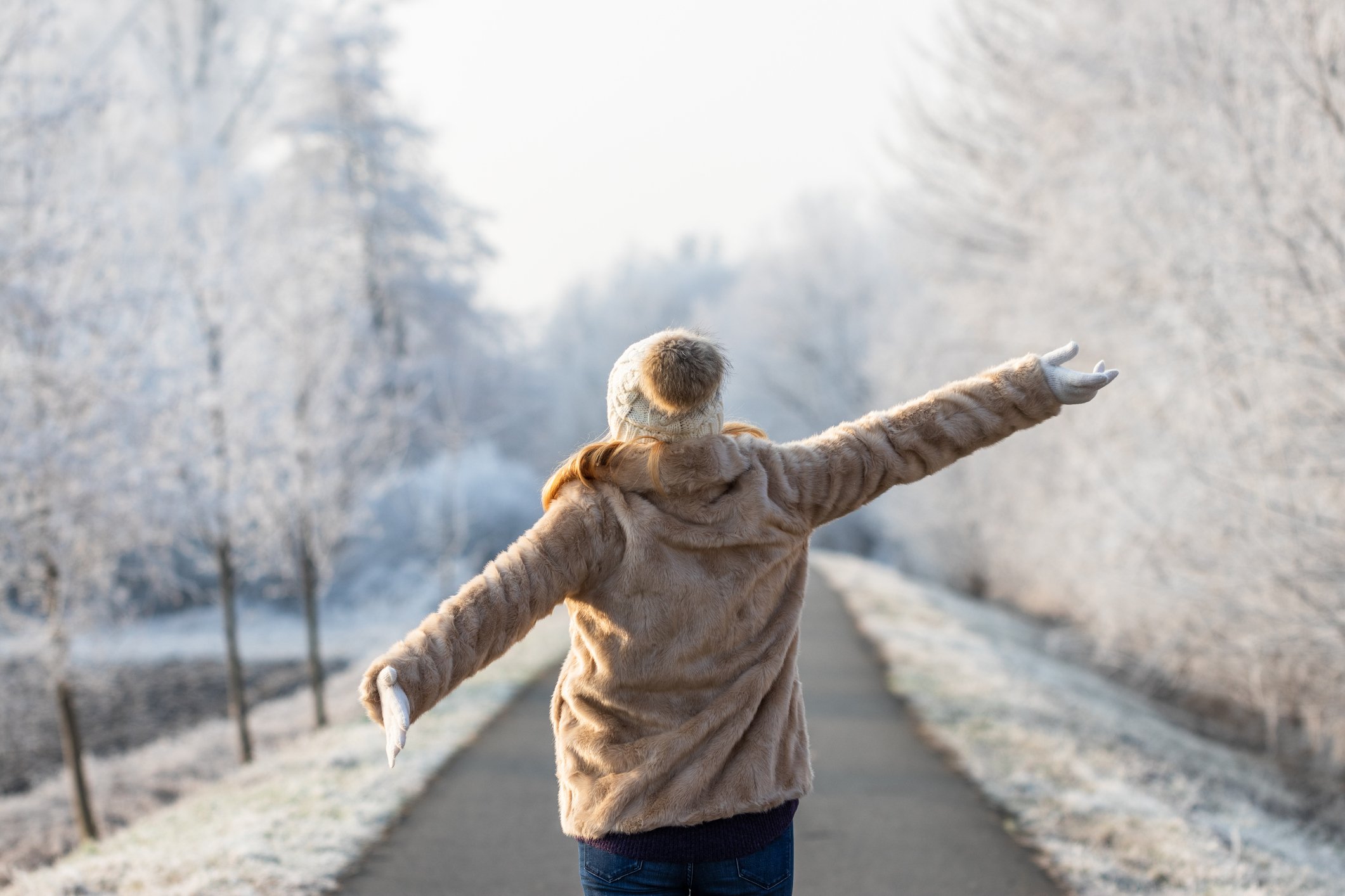 A woman walking outside in the snow