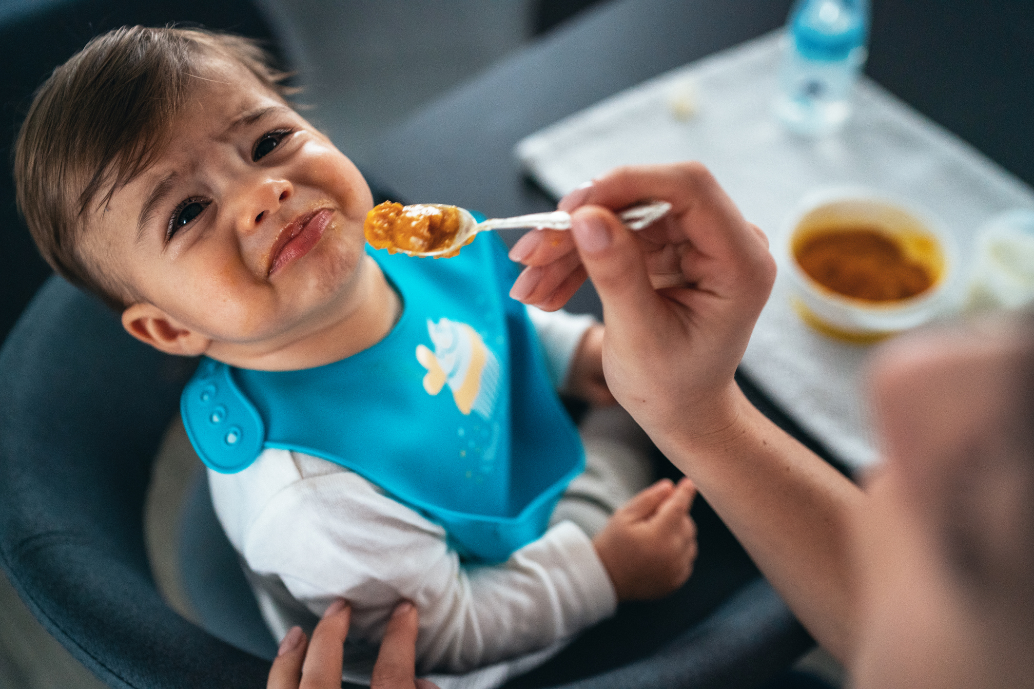 Trying to feed a baby boy