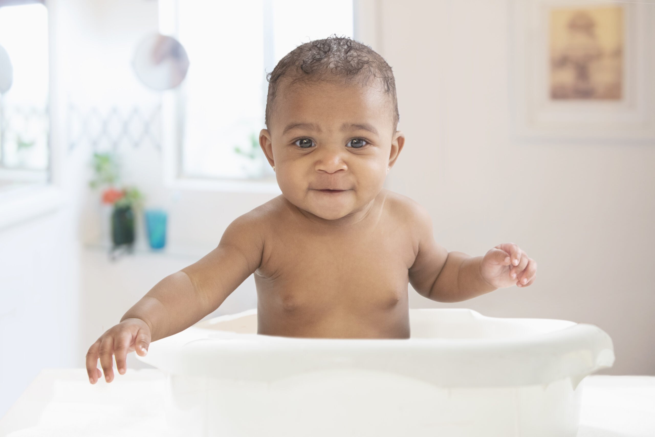 Baby having fun in the bathtub