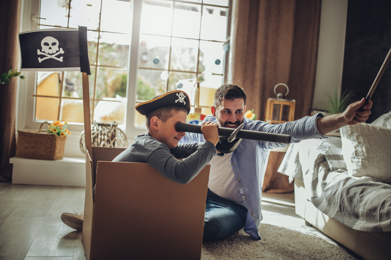 Father Playing Exciting Adventure  Game With Son