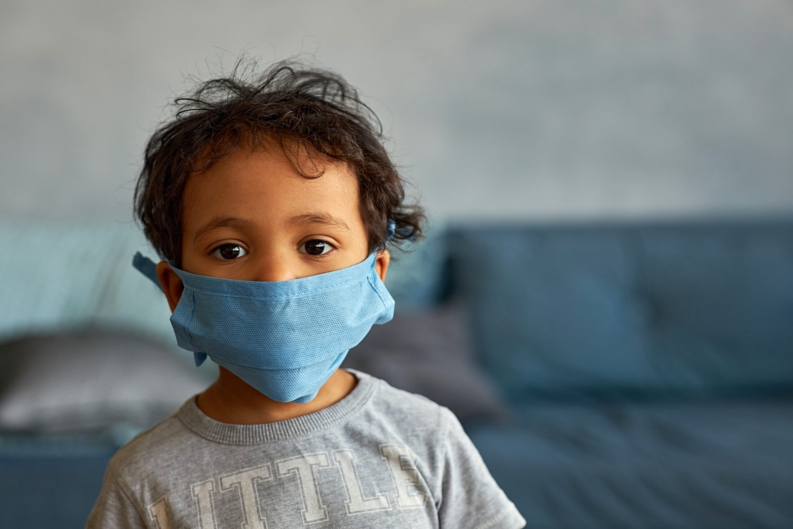 little boy in mask