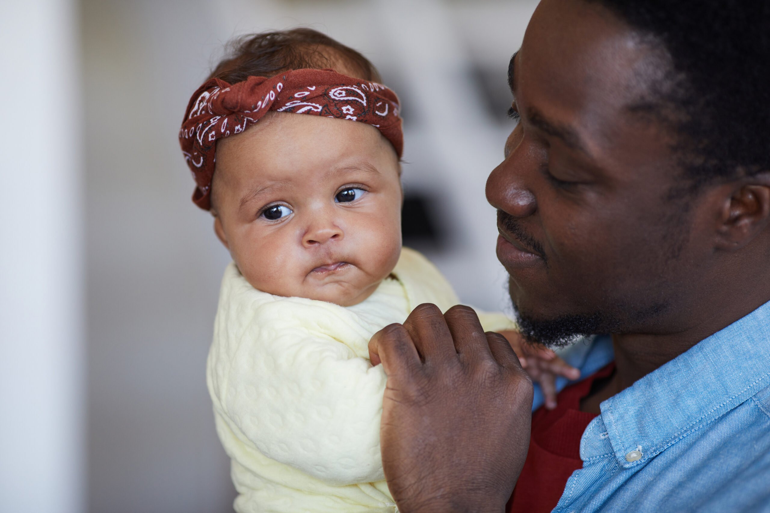 Man playing with baby