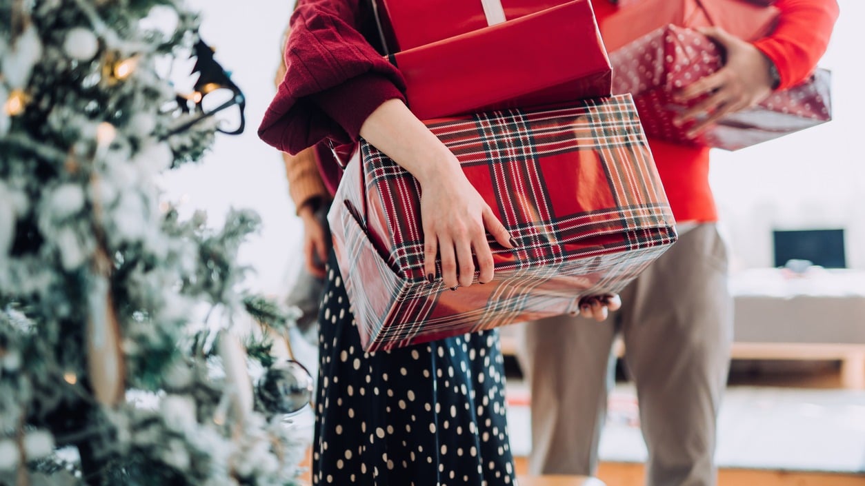 A woman carrying gifts