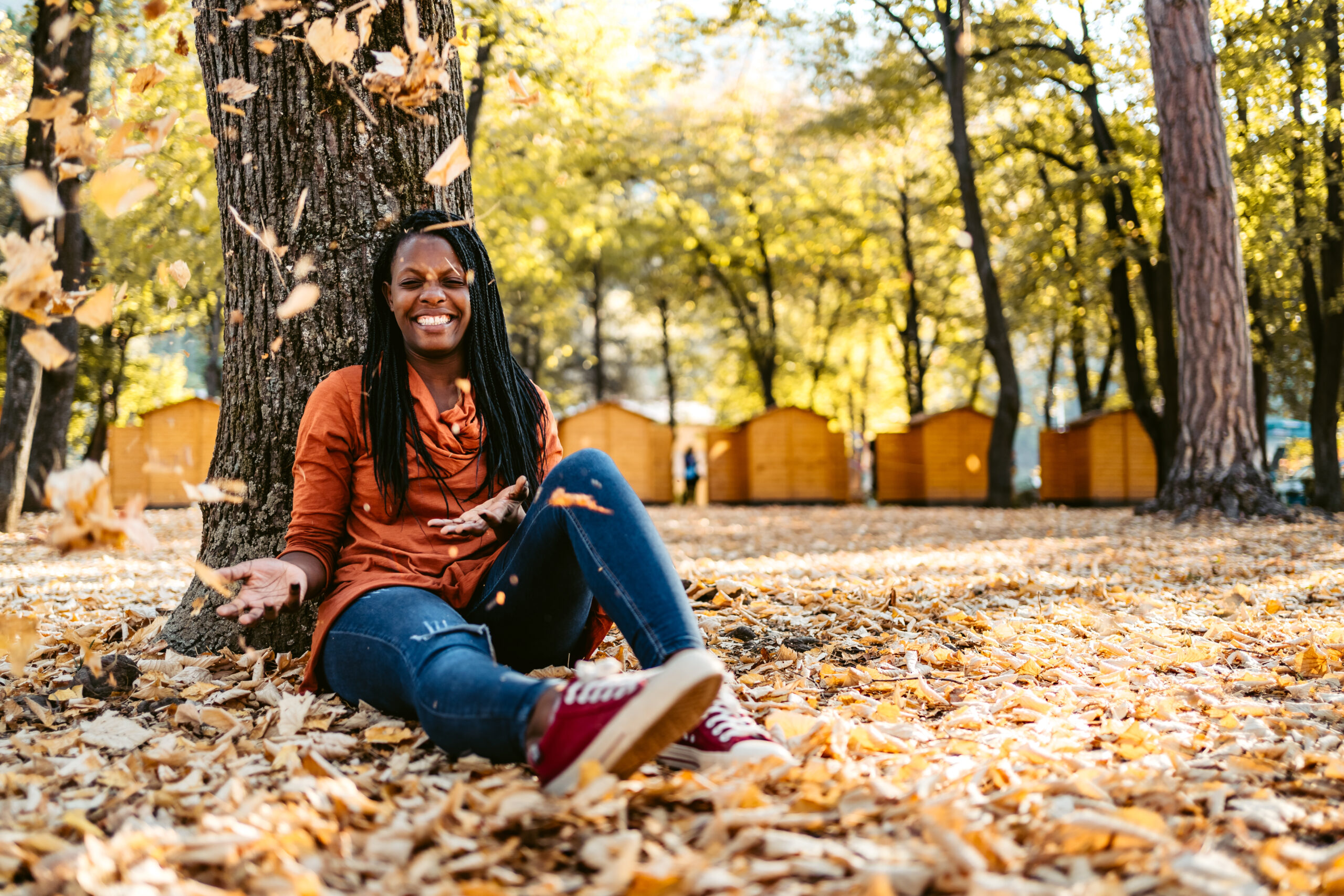 woman in fall leaves