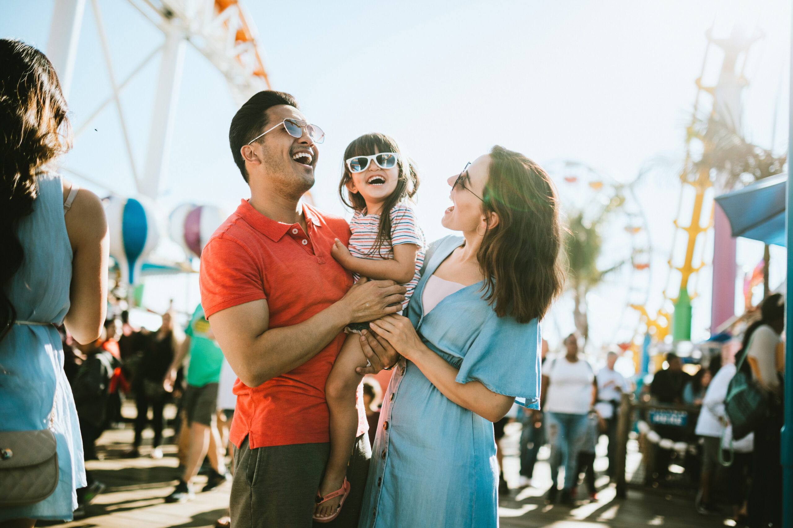 Family Has Fun at Outdoor Carnival Setting