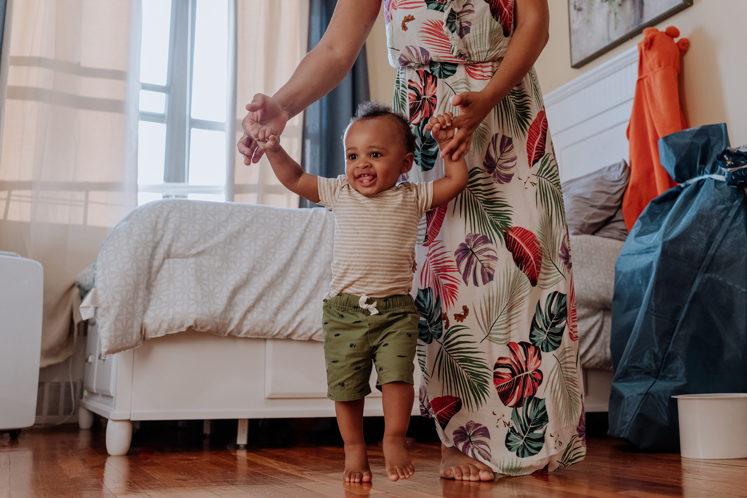 Black baby boy learning to walk