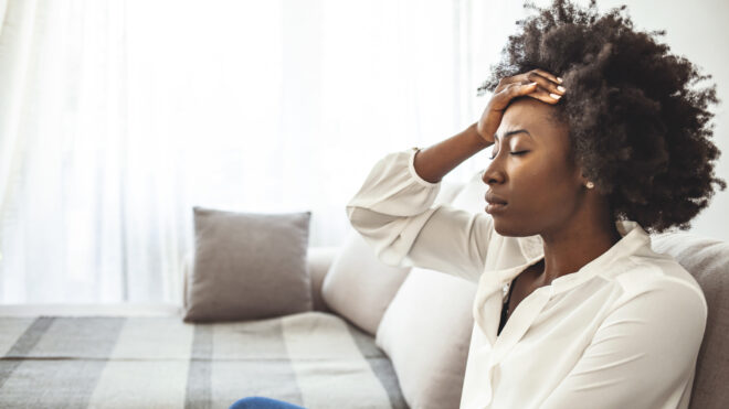 stressed woman on couch
