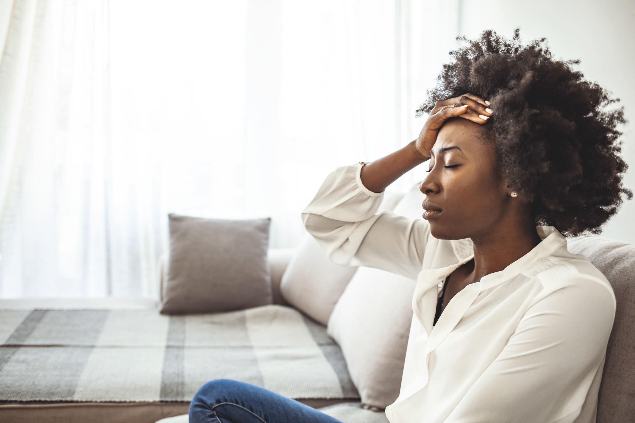 stressed woman on couch