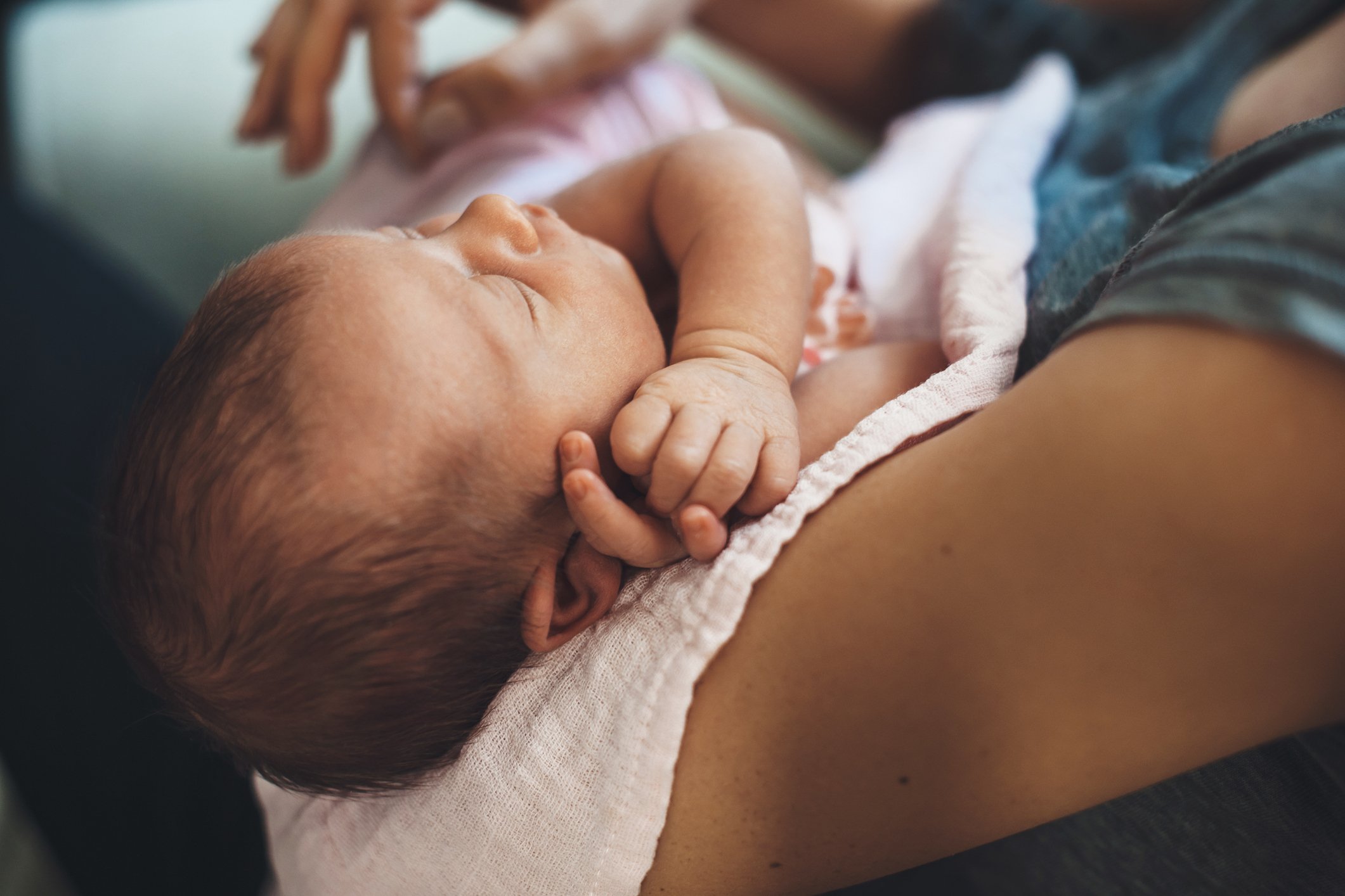 mom holding newborn baby