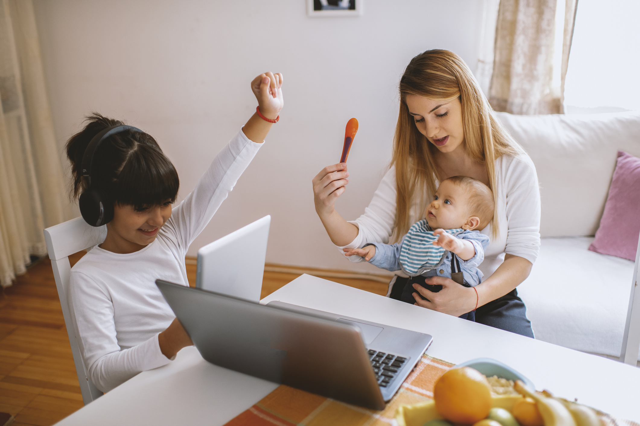 mom multitasking with two kids