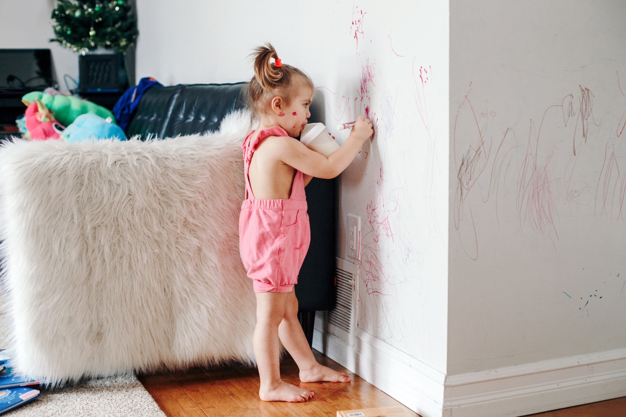 girl drawing on wall