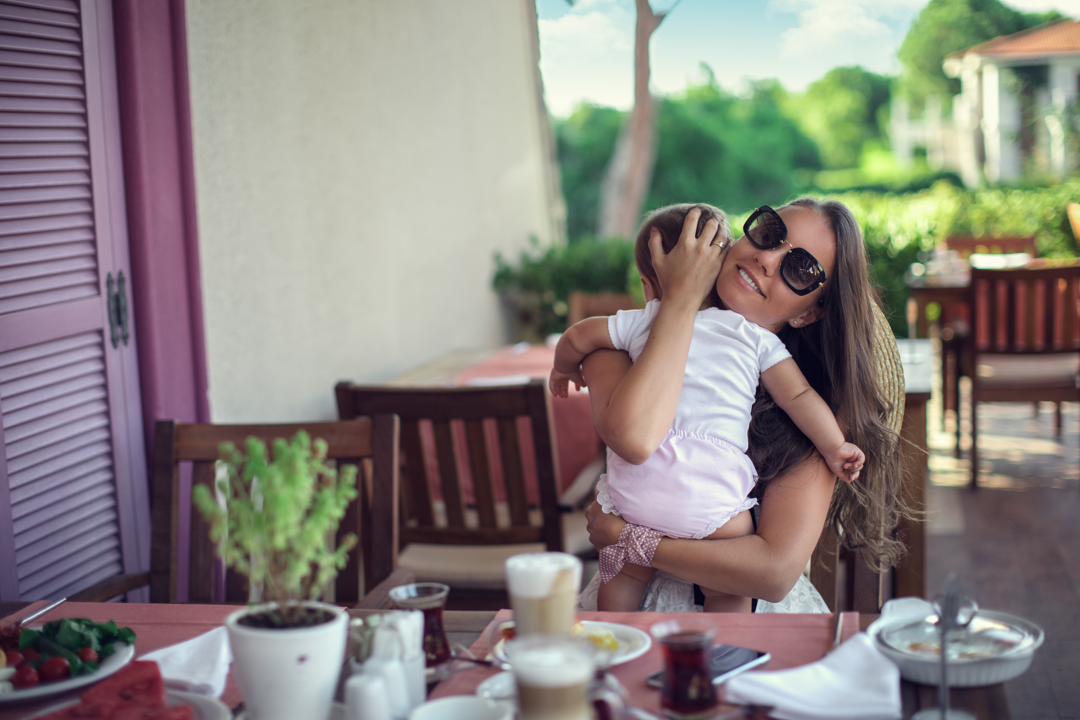 Mother relaxing together with her little child