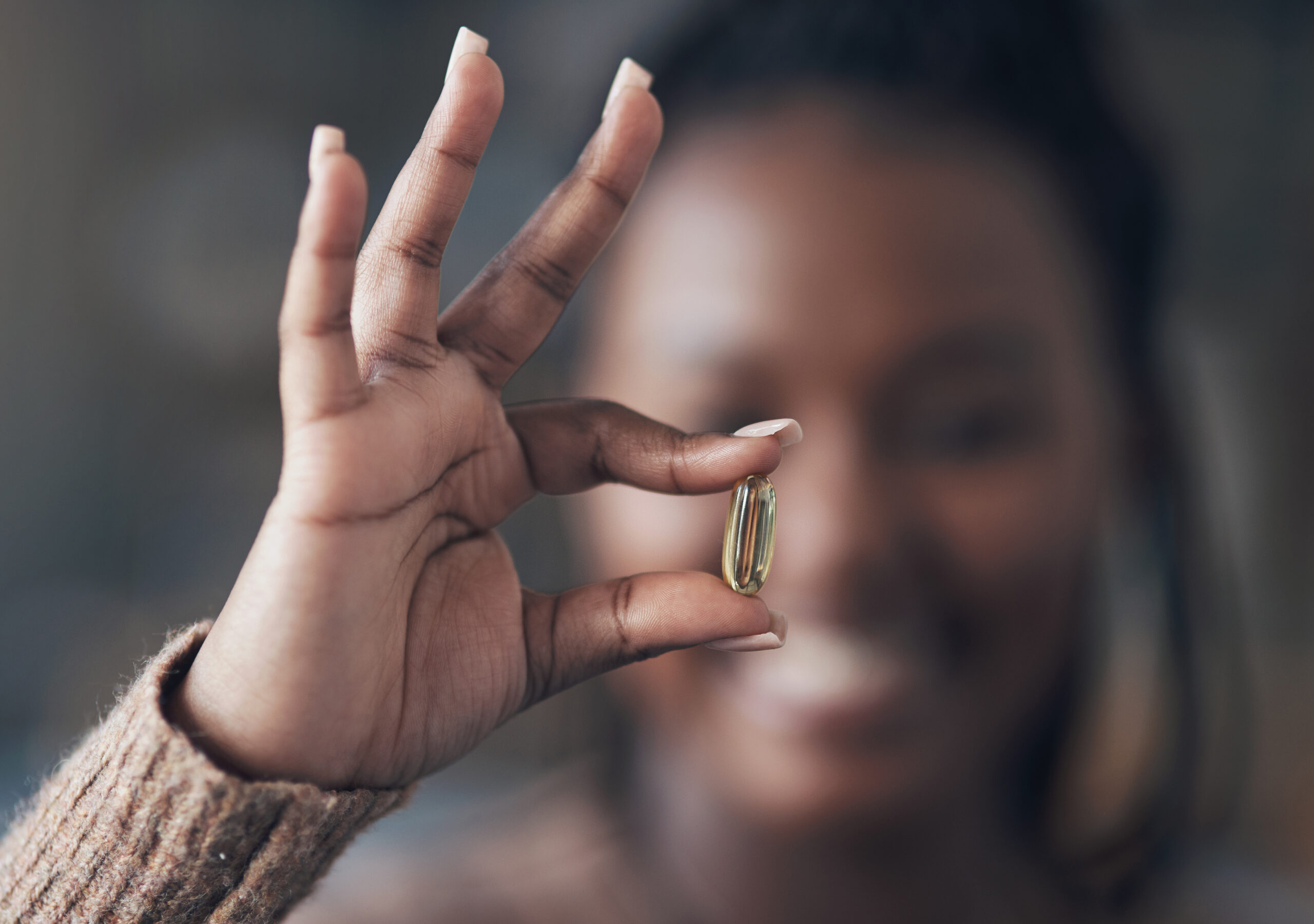 woman holding vitamin
