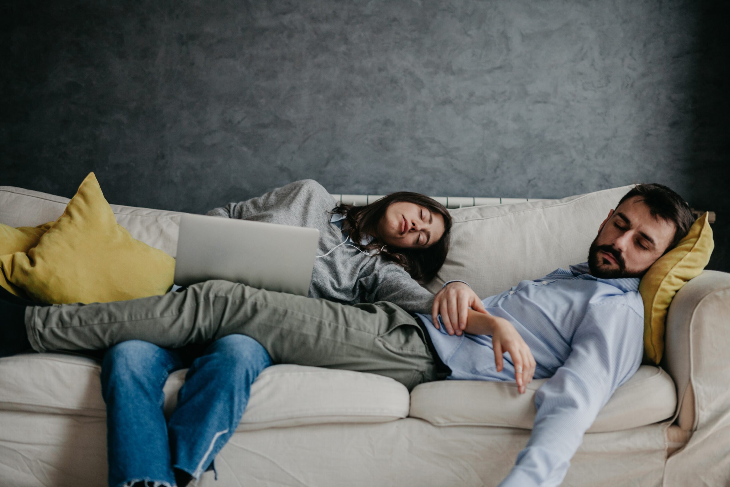 couple sleeping on couch