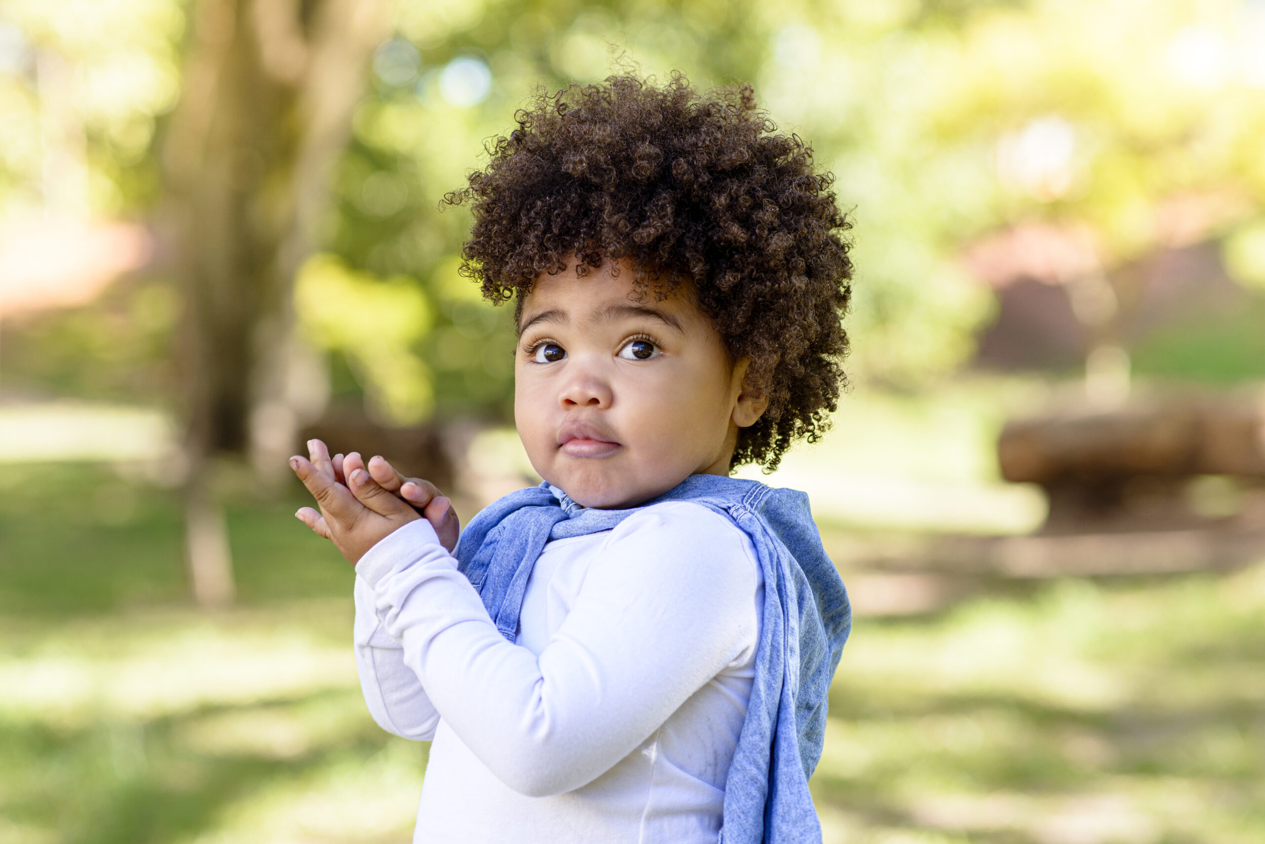 Child looking at camera with embarrassment