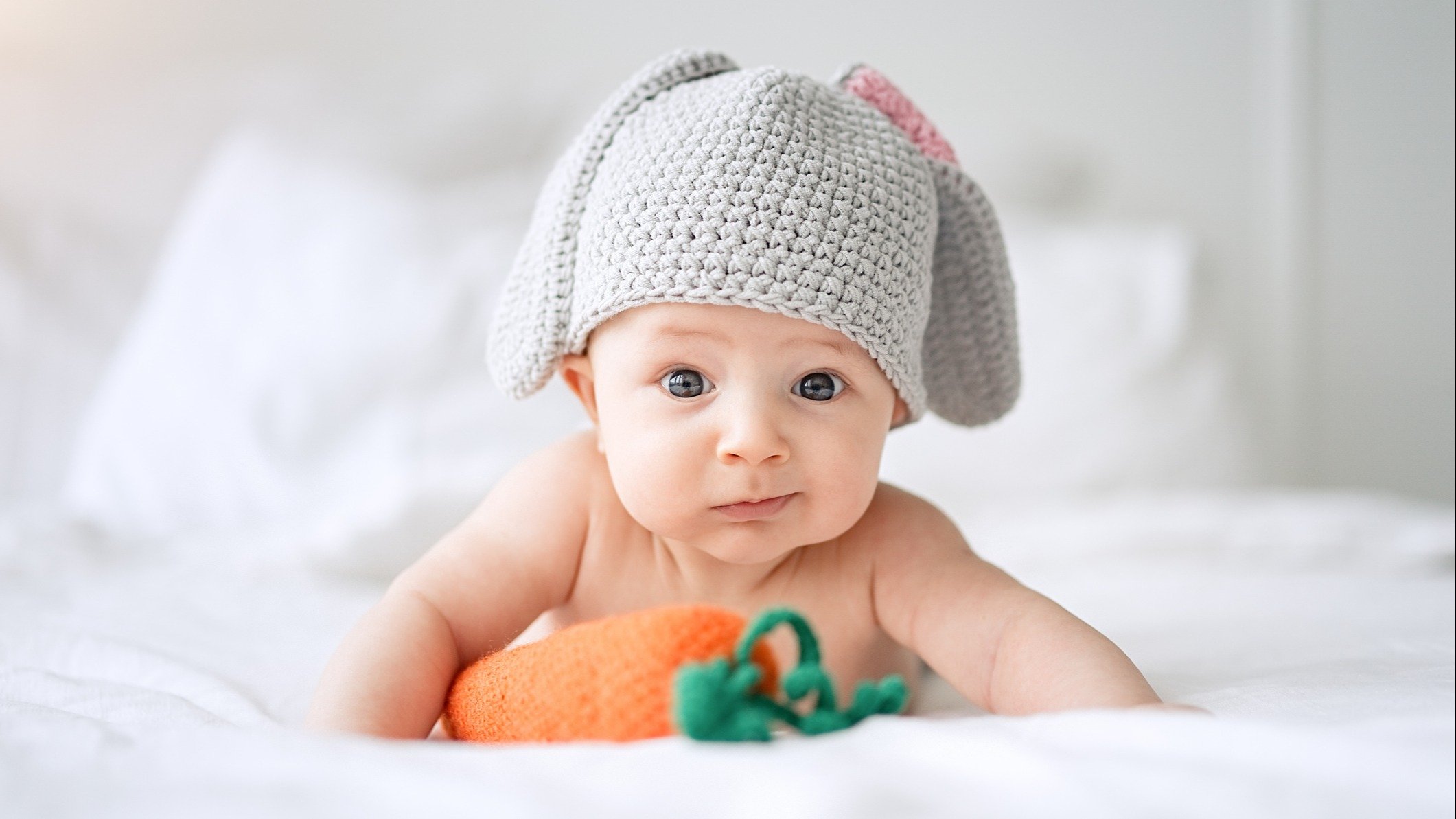 A baby posing for an Easter photo