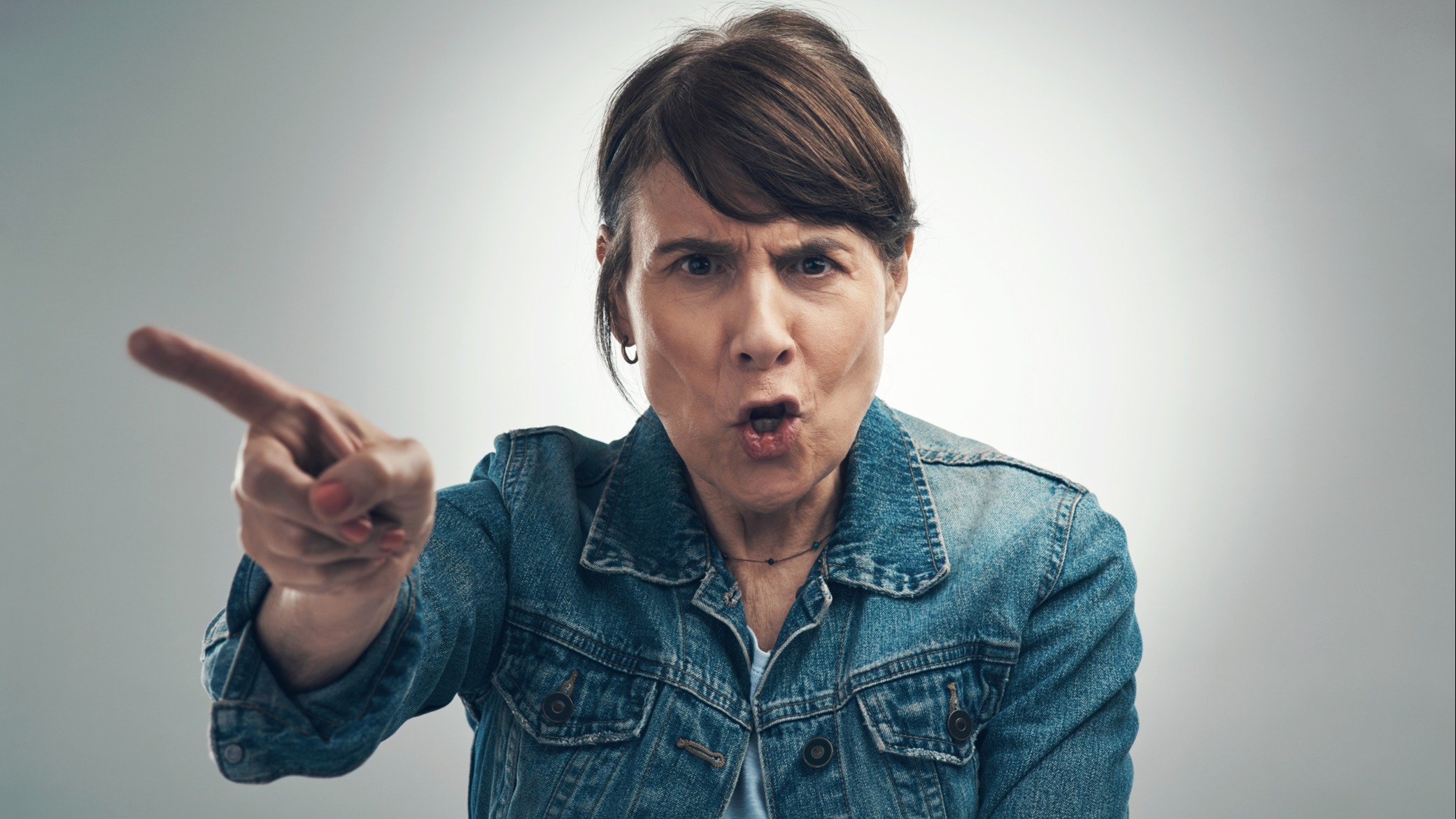A woman yelling and pointing her finger
