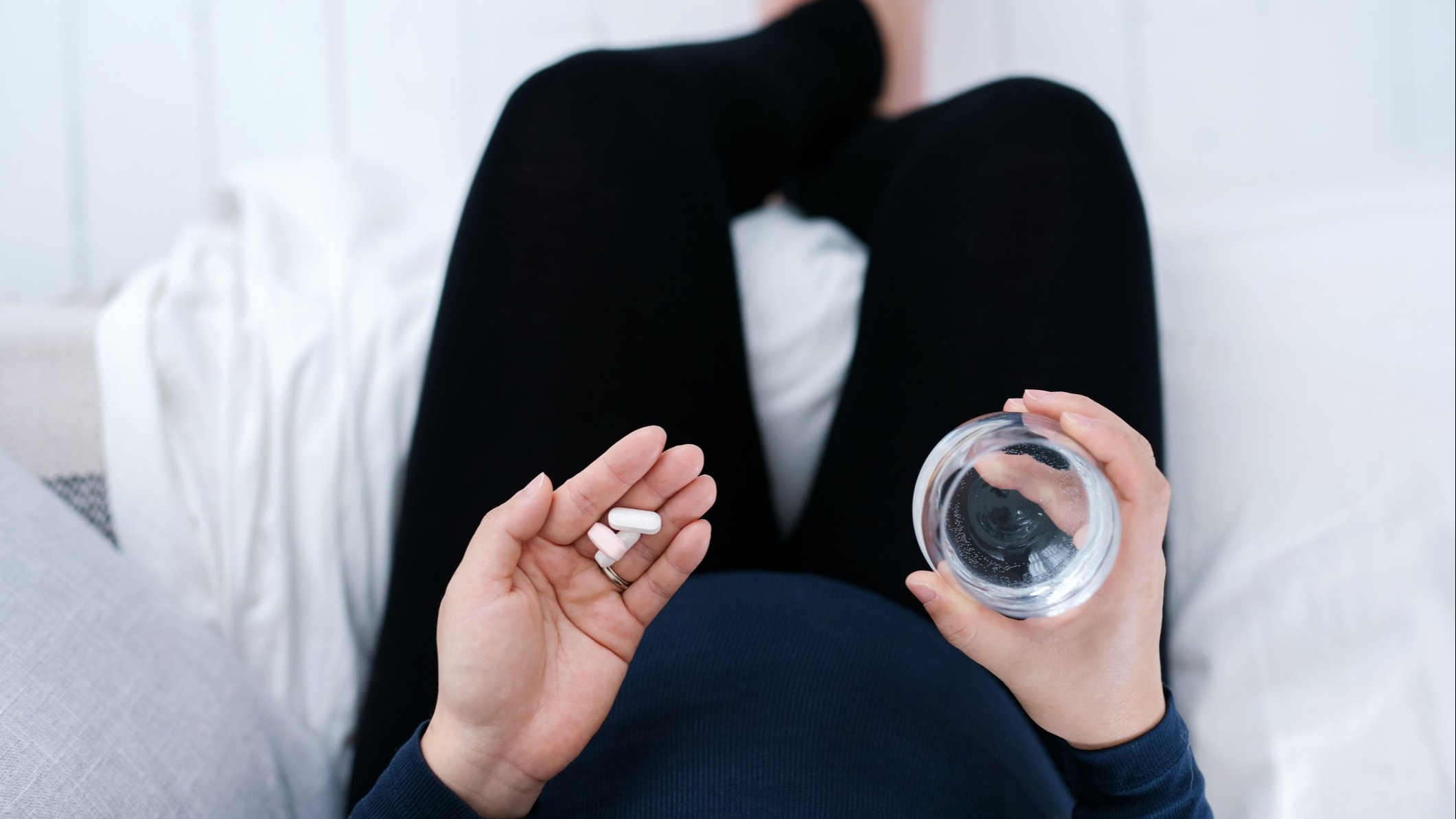 Pregnant woman taking medicine