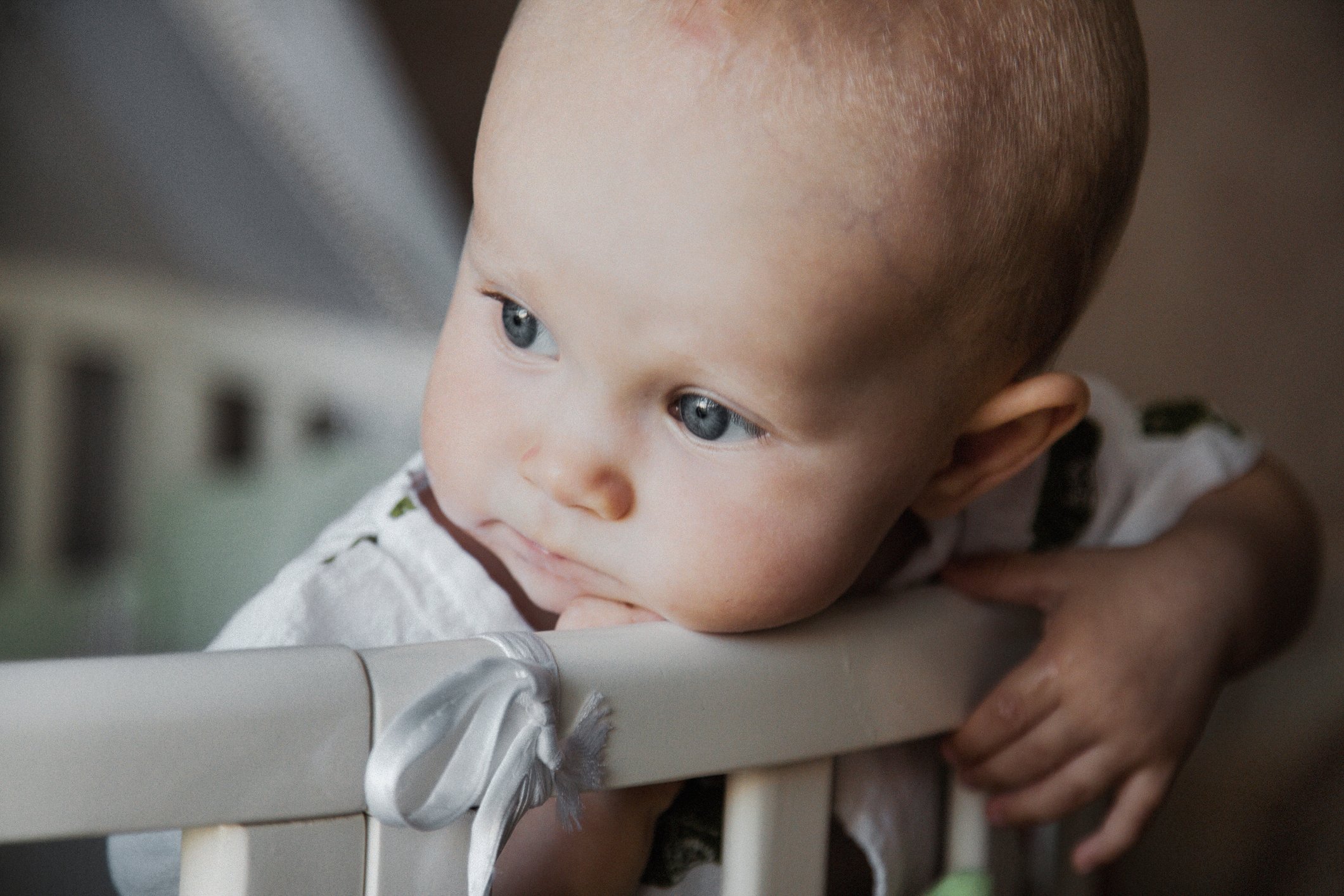 Small cute charming baby looking directly at camera