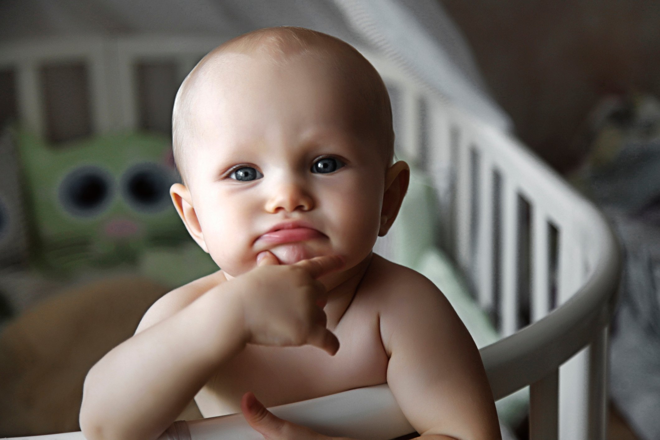 Small cute charming baby looking directly at camera