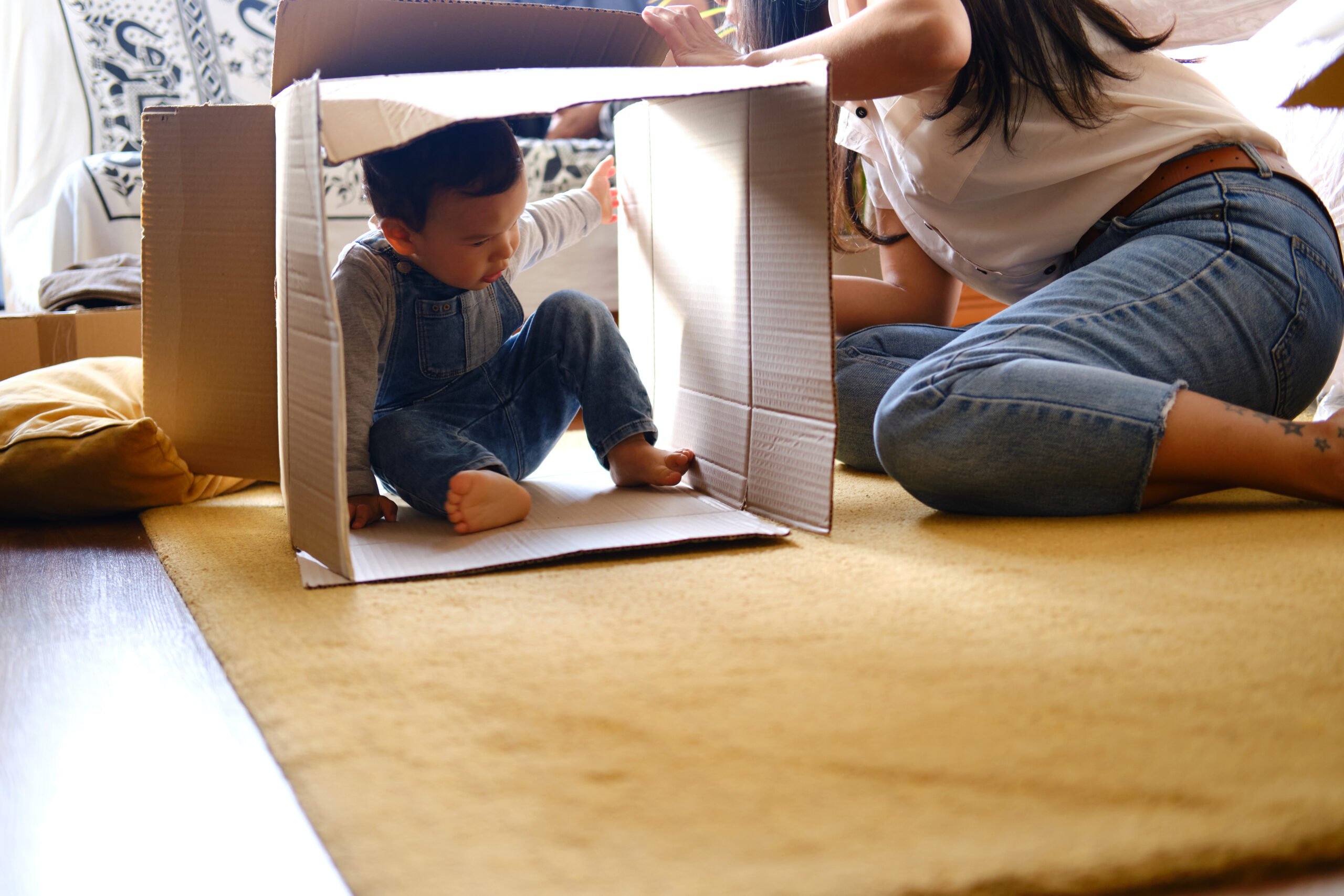 kid playing in box