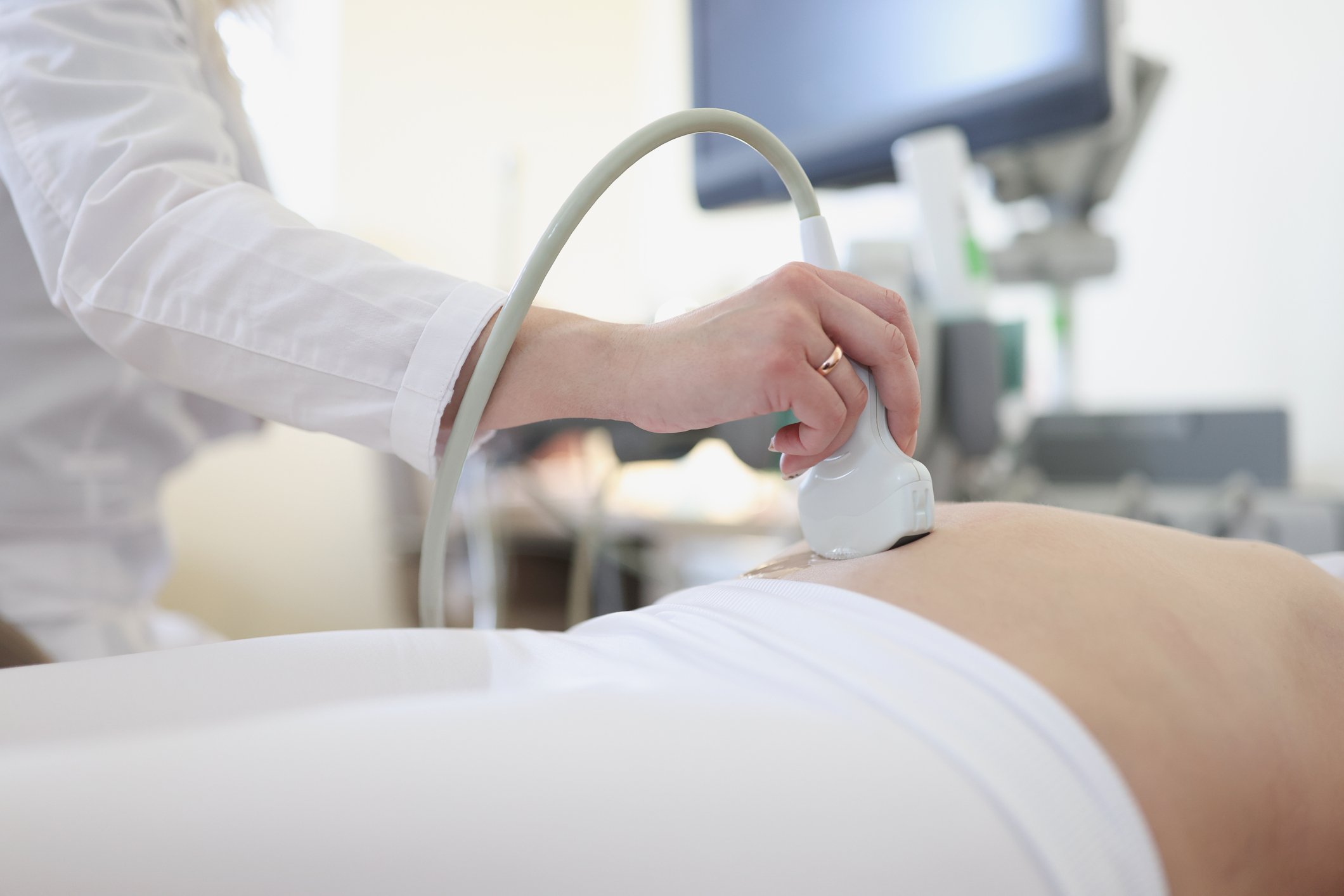Ultrasound scanner device in hand of professional doctor examining his patient