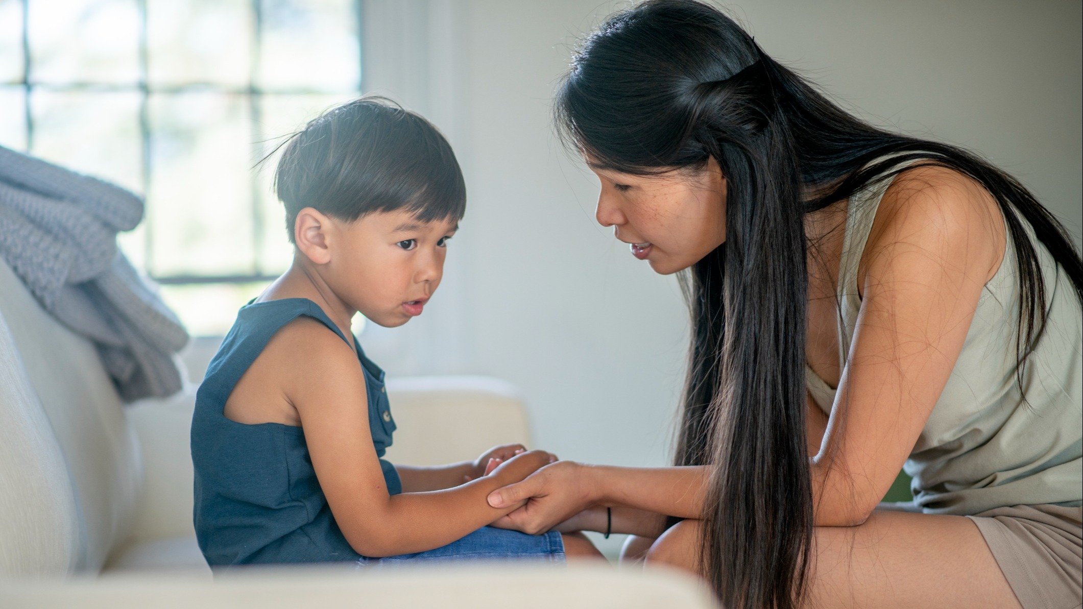 Mom talking to young child