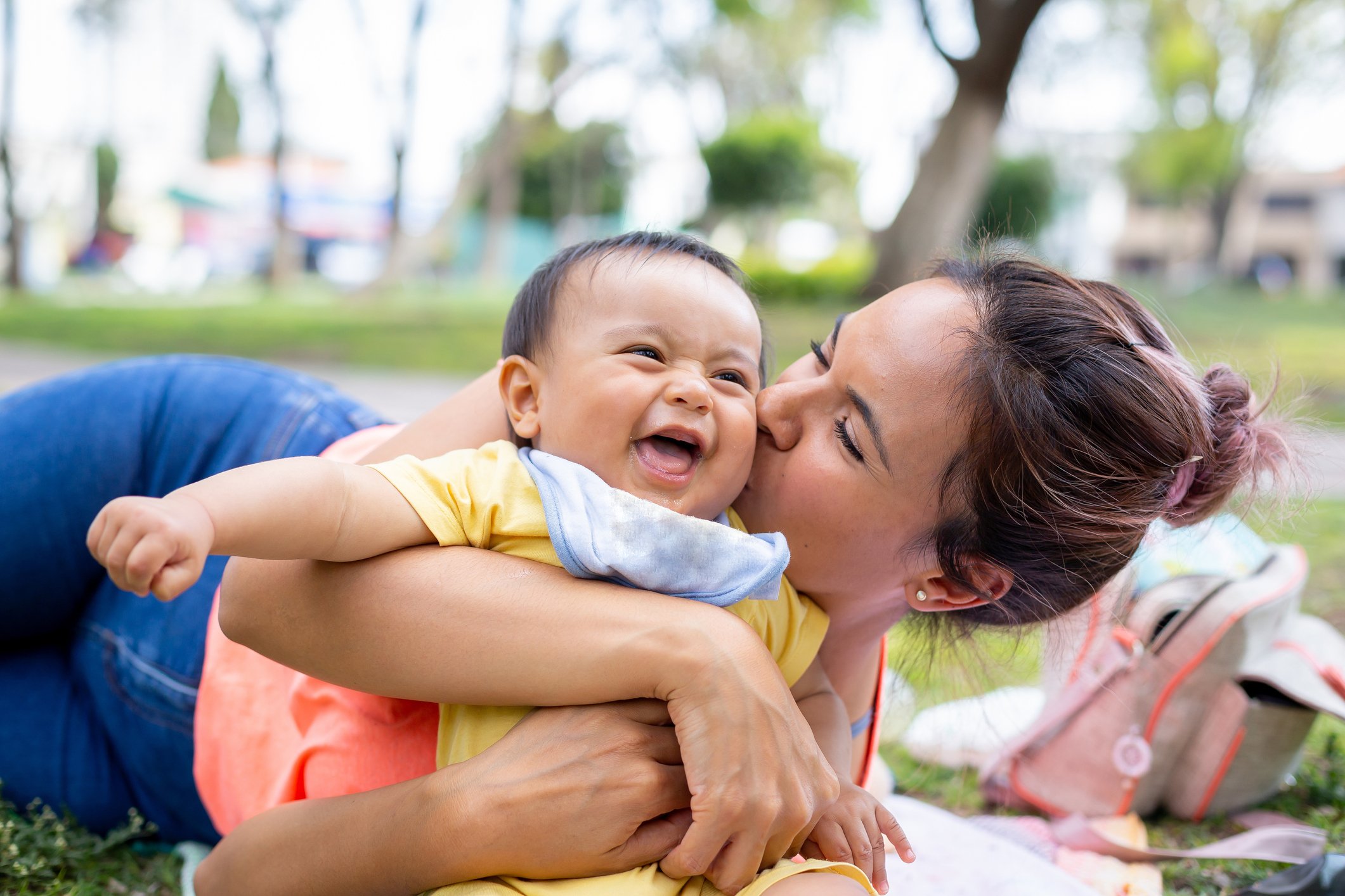 Happy mom and baby in the park