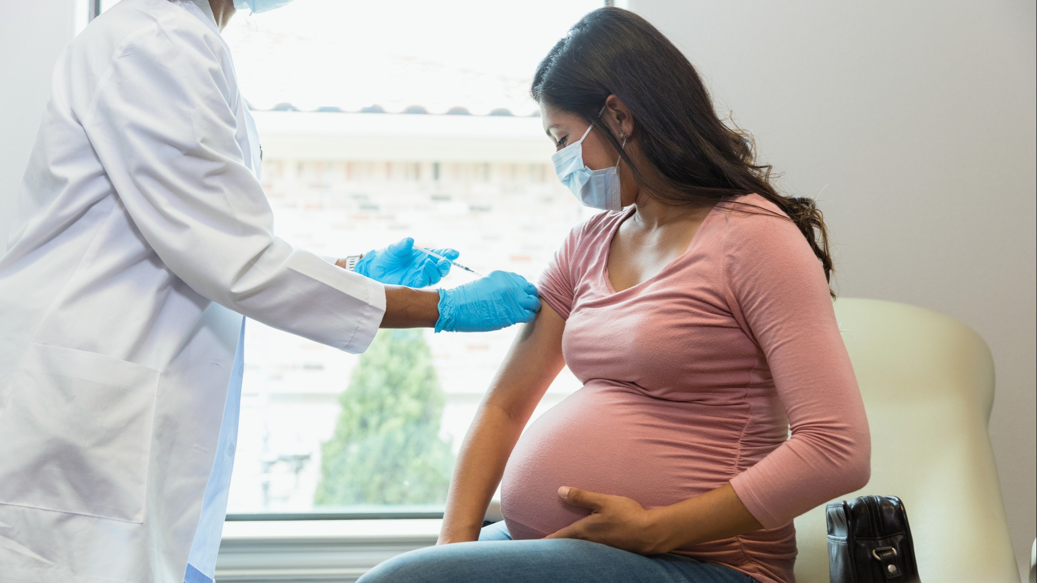 Pregnant woman getting a shot