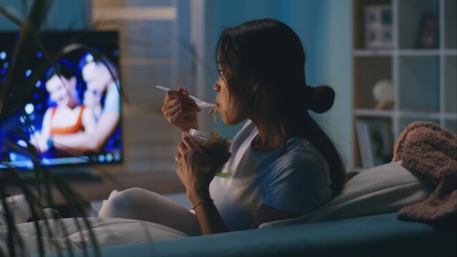 A mom sitting on the couch